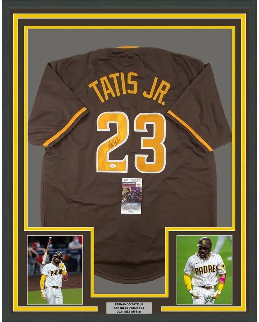 Framed Autographed Fernando Tatis Jr. MLB Jersey with JSA COA: Framed Autographed Fernando Tatis Jr. MLB Jersey with JSA COA Celebrate the legacy of Fernando Tatis Jr. with this professionally framed and autographed brown jersey, featuring a stunning display that