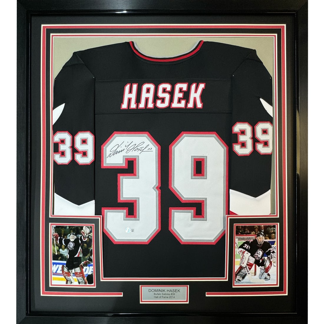 Framed Autographed Dominik Hasek Buffalo Sabres Jersey with BAS COA: Framed Autographed Dominik Hasek Buffalo Sabres Jersey with BAS COA Celebrate the legacy of Dominik Hasek with this stunning framed autographed black jersey from the Buffalo Sabres. Measuring 35x39 in