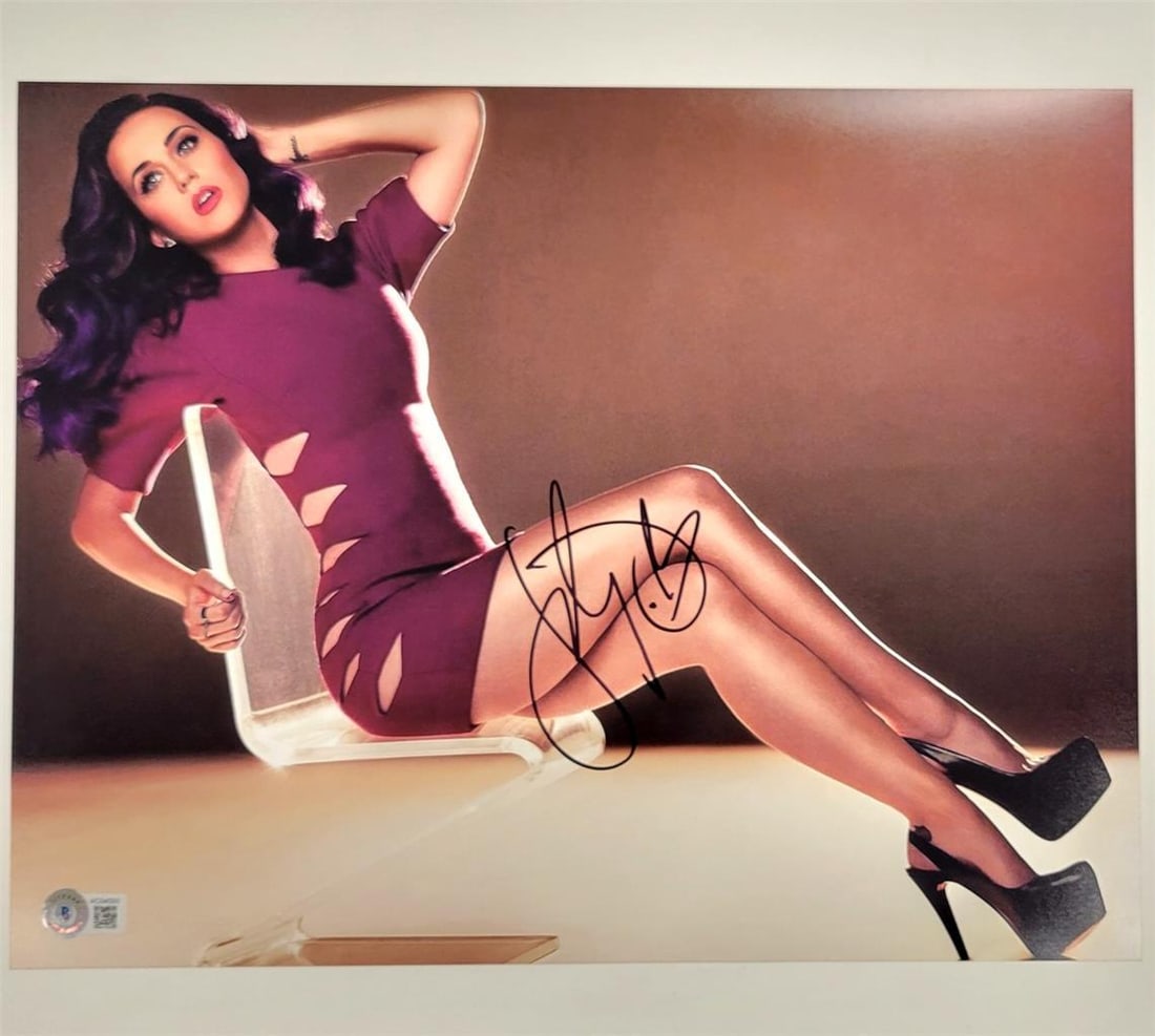 11x14 Photograph Signed by Katy Perry with Beckett Authentication: 11x14 Photograph Signed by Katy Perry with Beckett Authentication This is an original 11x14 photograph signed by Katy Perry, authenticated by Beckett. It features imagery from the Teenage Dream era an