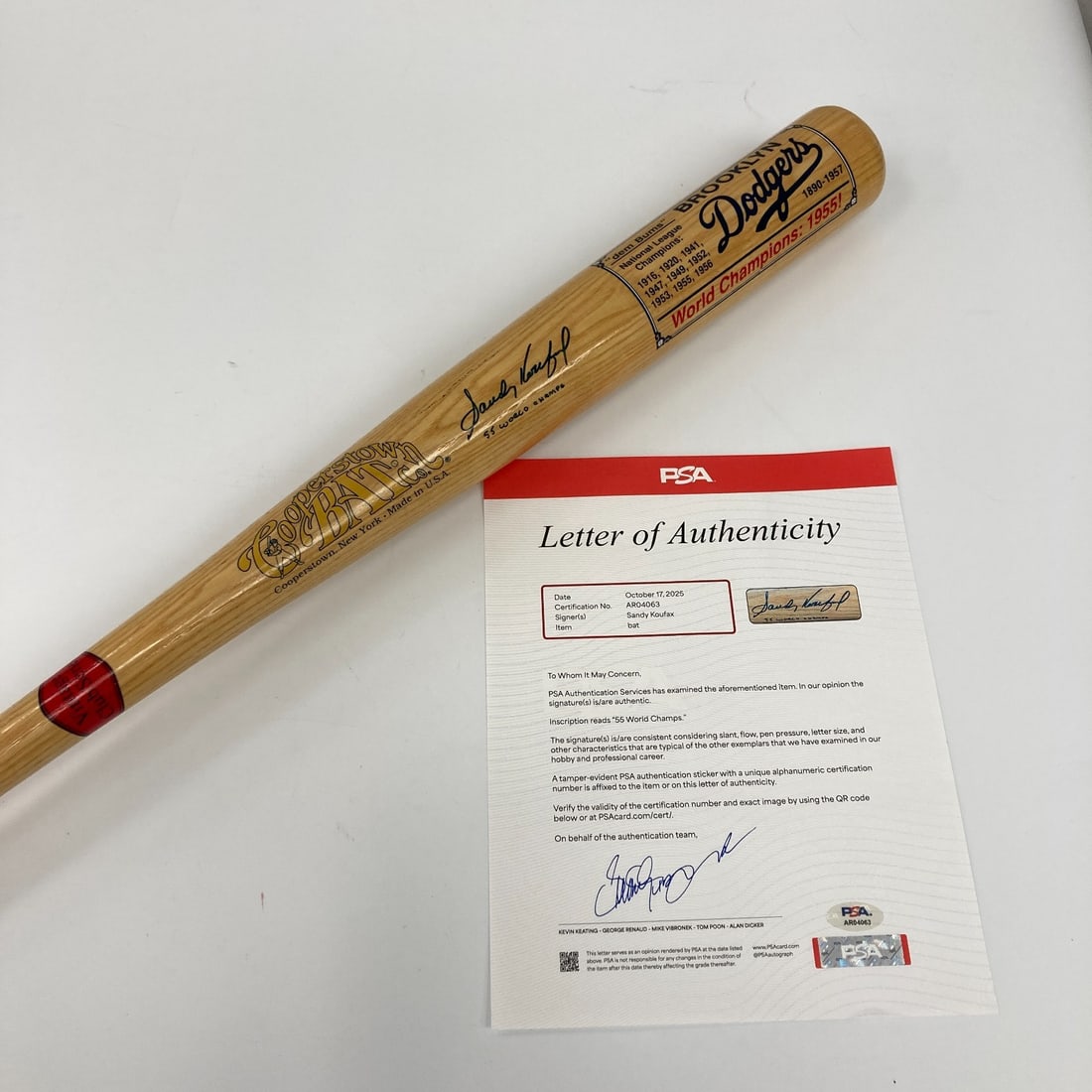 Sandy Koufax Signed Inscribed 1955 World Series Baseball Bat PSA DNA: Sandy Koufax Signed Inscribed 1955 World Series Baseball Bat PSA DNA This is a signed baseball bat commemorating Sandy Koufax and the 1955 World Series Championship. The bat, a Cooperstown edition, fe