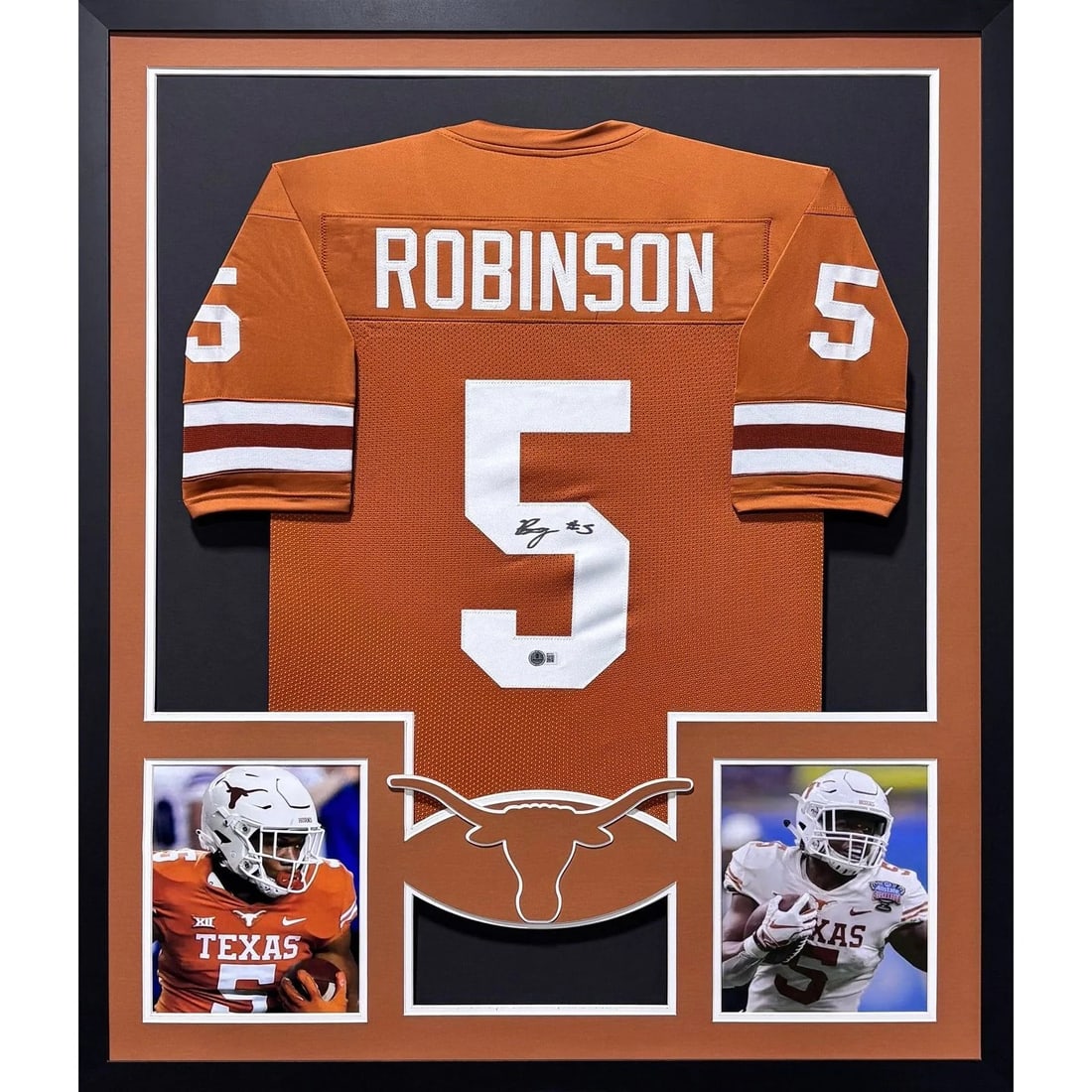 Framed Texas Orange Jersey Signed by Bijan Robinson Beckett Authenticated: Framed Texas Orange Jersey Signed by Bijan Robinson Beckett Authenticated This framed Texas orange jersey is autographed by Bijan Robinson and authenticated by Beckett, featuring a tamper-proof sticke