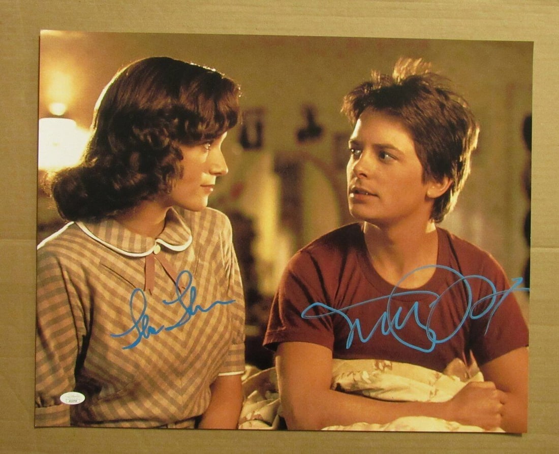 Michael J Fox Lea Thompson Dual Autographed 16x20 Photo Back to the Future JSA Certified: Michael J Fox Lea Thompson Dual Autographed 16x20 Photo Back to the Future JSA Certified This is a dual-autographed 16x20 photo featuring Michael J. Fox and Lea Thompson from the iconic film "Back to