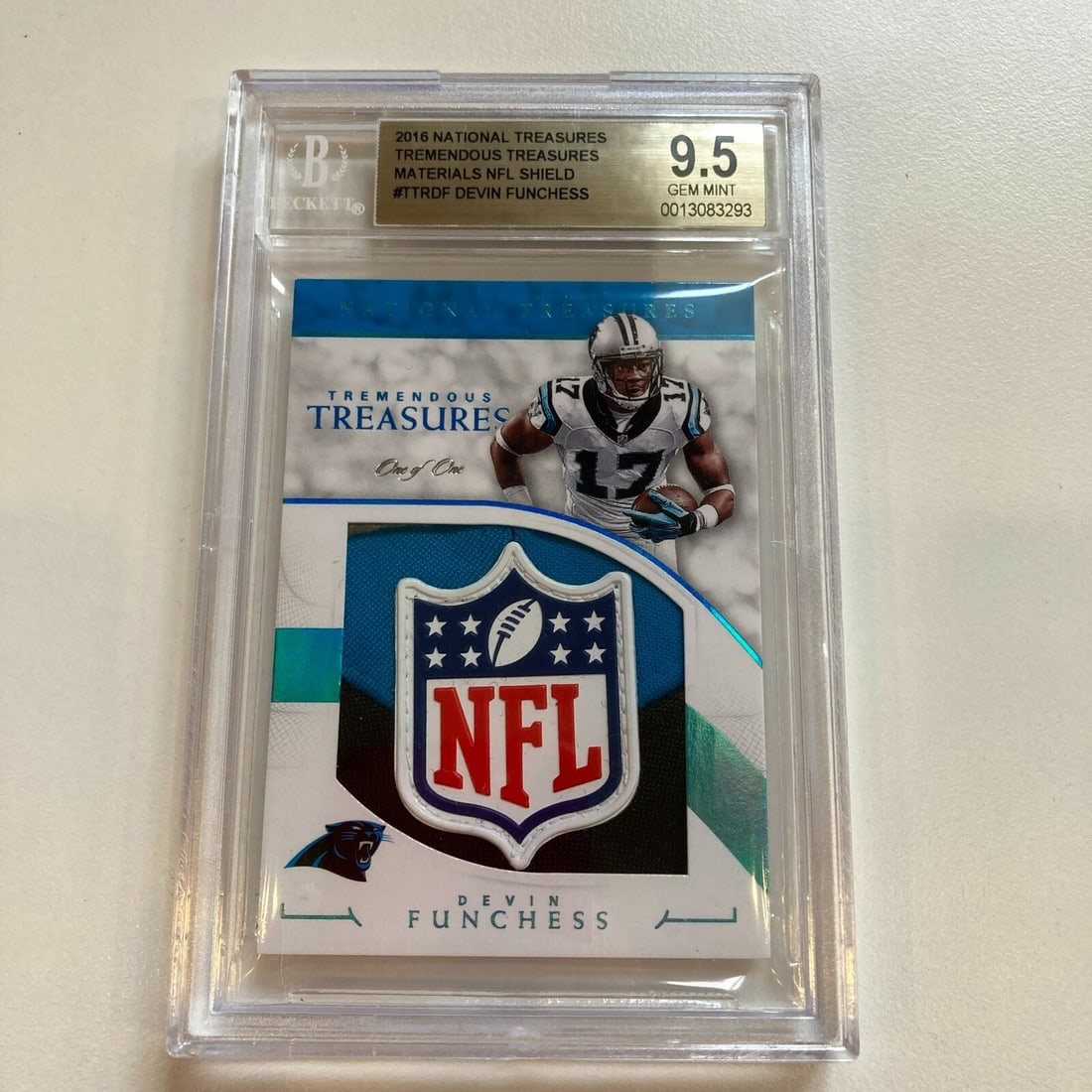 BGS 9.5 graded 2016 NFL Shield Patch card 1 of 1 Devin Funchess: BGS 9.5 graded 2016 NFL Shield Patch card 1 of 1 Devin Funchess This is a 2016 National Treasures Devin Funchess sports trading card featuring an NFL Shield patch. The card is a unique 1/1 (one of one