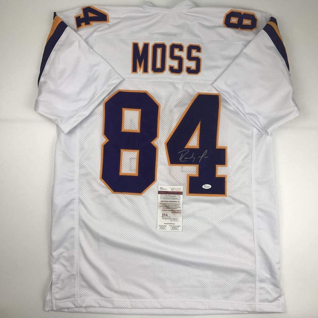Randy Moss Autographed Minnesota Vikings White Jersey with JSA COA: Randy Moss Autographed Minnesota Vikings White Jersey with JSA COA Own a piece of NFL history with this autographed Randy Moss Minnesota Vikings white football jersey. This custom jersey features the