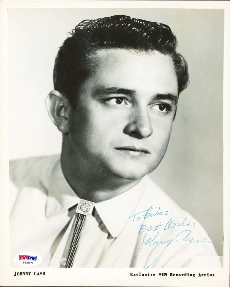 Johnny Cash Signed 8x10 B&W Promo Photo PSA/DNA Certified: Johnny Cash Signed 8x10 B&W Promo Photo PSA/DNA Certified This stunning black and white 8x10 promotional photograph features the legendary Johnny Cash, personally autographed for fans and collectors.