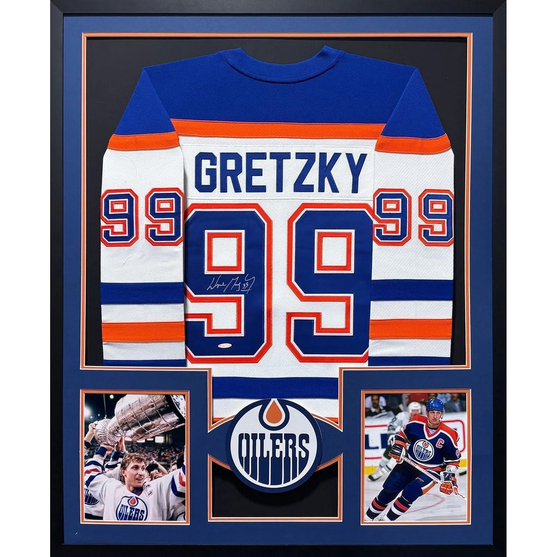 Framed Edmonton Oilers Jersey Signed by Wayne Gretzky with UDA Authentication: Framed Edmonton Oilers Jersey Signed by Wayne Gretzky with UDA Authentication This is a framed Edmonton Oilers white jersey autographed by Wayne Gretzky. The jersey has been authenticated by Upper Dec