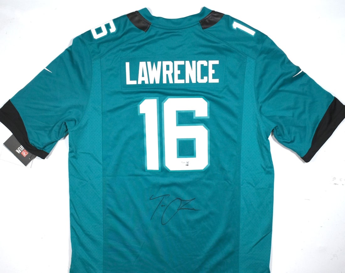 Signed Jacksonville Jaguars Nike Teal Jersey Authenticated by Fanatics: Signed Jacksonville Jaguars Nike Teal Jersey Authenticated by Fanatics This is a pre-owned Jacksonville Jaguars Nike teal game jersey autographed by Trevor Lawrence. The autograph has been authenticat