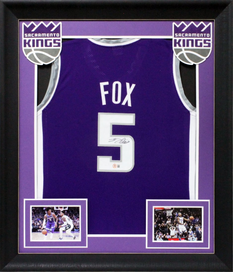 Framed Purple Jersey Signed by De'Aaron Fox Beckett Witnessed Authentic: Framed Purple Jersey Signed by De'Aaron Fox Beckett Witnessed Authentic This is an original purple pro style jersey that has been personally signed by De'Aaron Fox of the Sacramento Kings. The jersey