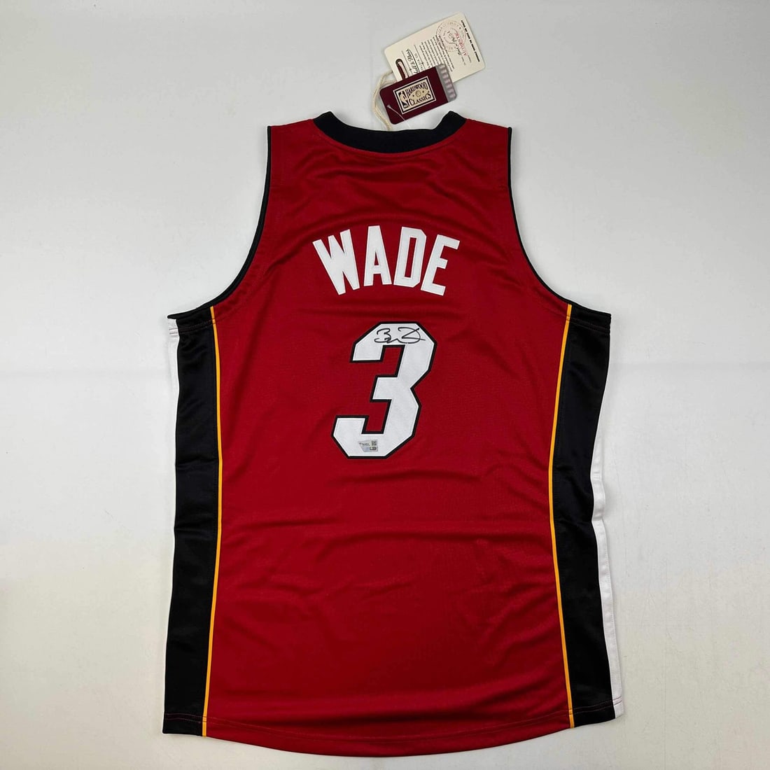 Dwyane Wade Signed Miami Heat Red Jersey 2005-06 with Fanatics COA: Dwyane Wade Signed Miami Heat Red Jersey 2005-06 with Fanatics COA This is an authentic autographed Dwyane Wade Miami Heat red jersey from the 2005-06 season, manufactured by Mitchell & Ness. The jers