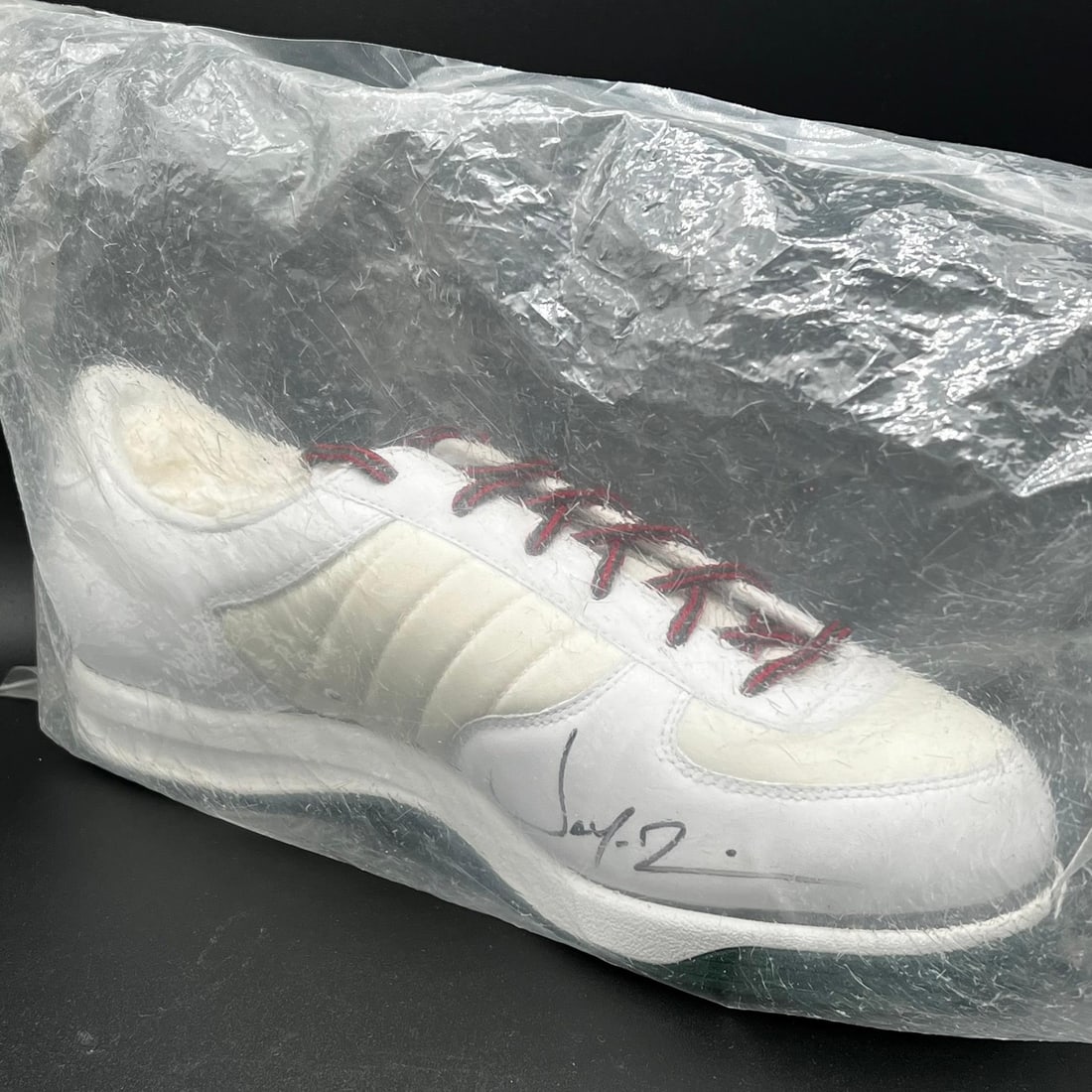 Jay-Z Autographed Adidas Shoe PSA/DNA Authentic Music Collectible: Jay-Z Autographed Adidas Shoe PSA/DNA Authentic Music Collectible This is an original Adidas shoe autographed by the renowned musician Jay-Z. The authenticity of the signature has been verified by PSA