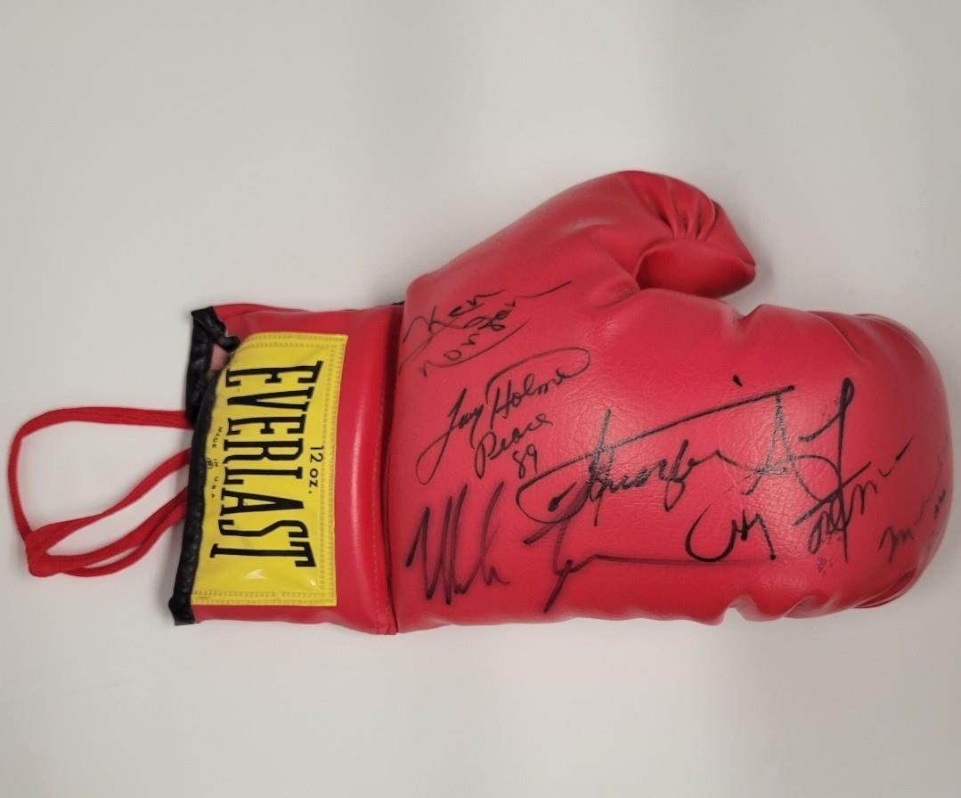 Muhammad Ali Signed Boxing Glove with Tyson Frazier Foreman BAS: Muhammad Ali Signed Boxing Glove with Tyson Frazier Foreman BAS This is an authentic boxing glove signed by legendary boxer Muhammad Ali, also known as Cassius Clay, along with notable fighters Tyson,