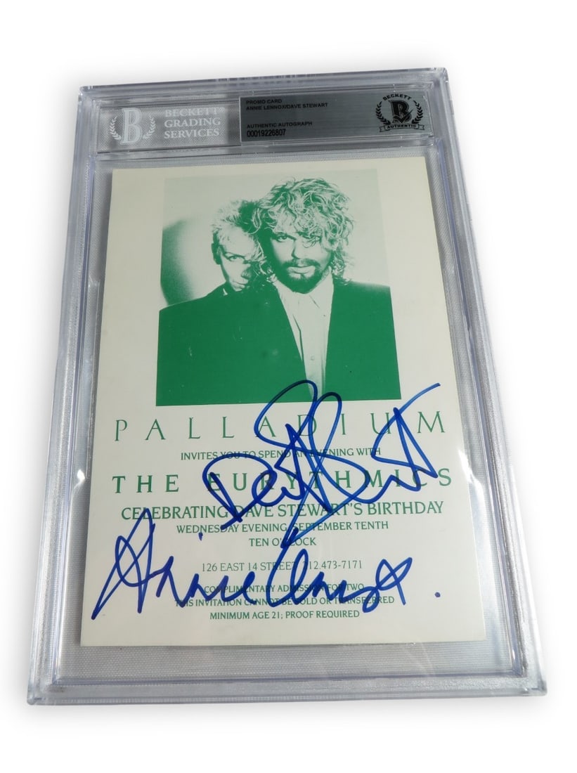 Beckett Authenticated Eurythmics Photo Signed by Annie Lennox and Dave Stewart: Beckett Authenticated Eurythmics Photo Signed by Annie Lennox and Dave Stewart This original photograph is dual signed by Annie Lennox and Dave Stewart of The Eurythmics. The item served as a VIP invi