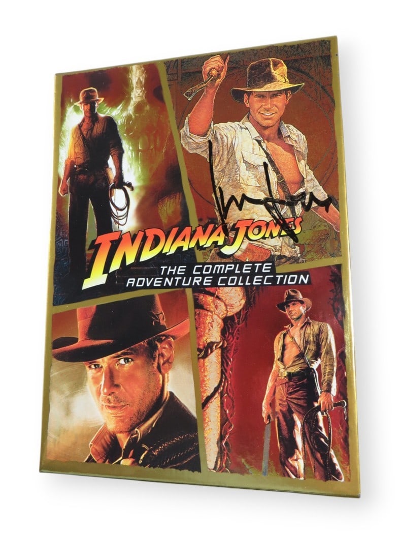 Harrison Ford Autographed Indiana Jones DVD Cover Beckett Authenticated: Harrison Ford Autographed Indiana Jones DVD Cover Beckett Authenticated This is an original DVD cover from the Indiana Jones Collection, autographed by the legendary actor Harrison Ford. The item is a