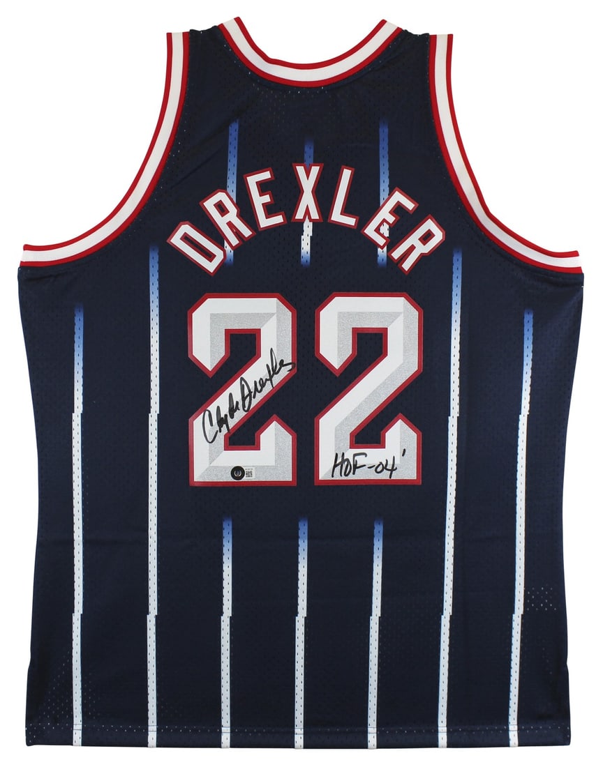 Clyde Drexler Signed Navy Jersey HOF 04 Mitchell & Ness BAS Witnessed: Clyde Drexler Signed Navy Jersey HOF 04 Mitchell & Ness BAS Witnessed This authentic navy blue Mitchell & Ness jersey features the iconic Clyde Drexler's autograph, complete with the inscription "HOF