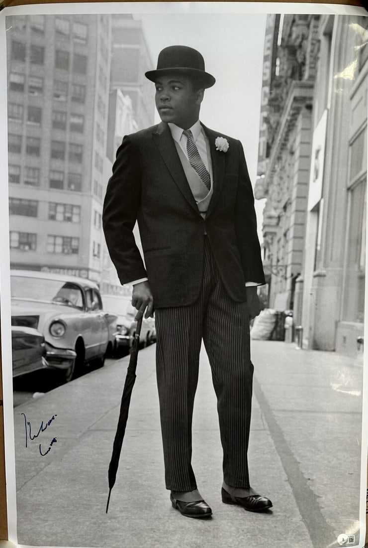 Muhammad Ali Signed 21x31 Photo Beckett Authentication: Muhammad Ali Signed 21x31 Photo Beckett Authentication This oversized 21x31 black and white photograph features the iconic Muhammad Ali, also known as Cassius Clay, who has signed it in black permanen