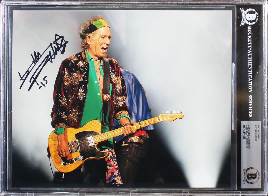 Keith Richards Signed 8x10 Photograph Beckett Slabbed Gem Mint 10 Autograph Reproduction: Keith Richards Signed 8x10 Photograph Beckett Slabbed Gem Mint 10 Autograph Reproduction This is an 8x10 reproduction photograph personally signed by Keith Richards of The Rolling Stones. The autograp