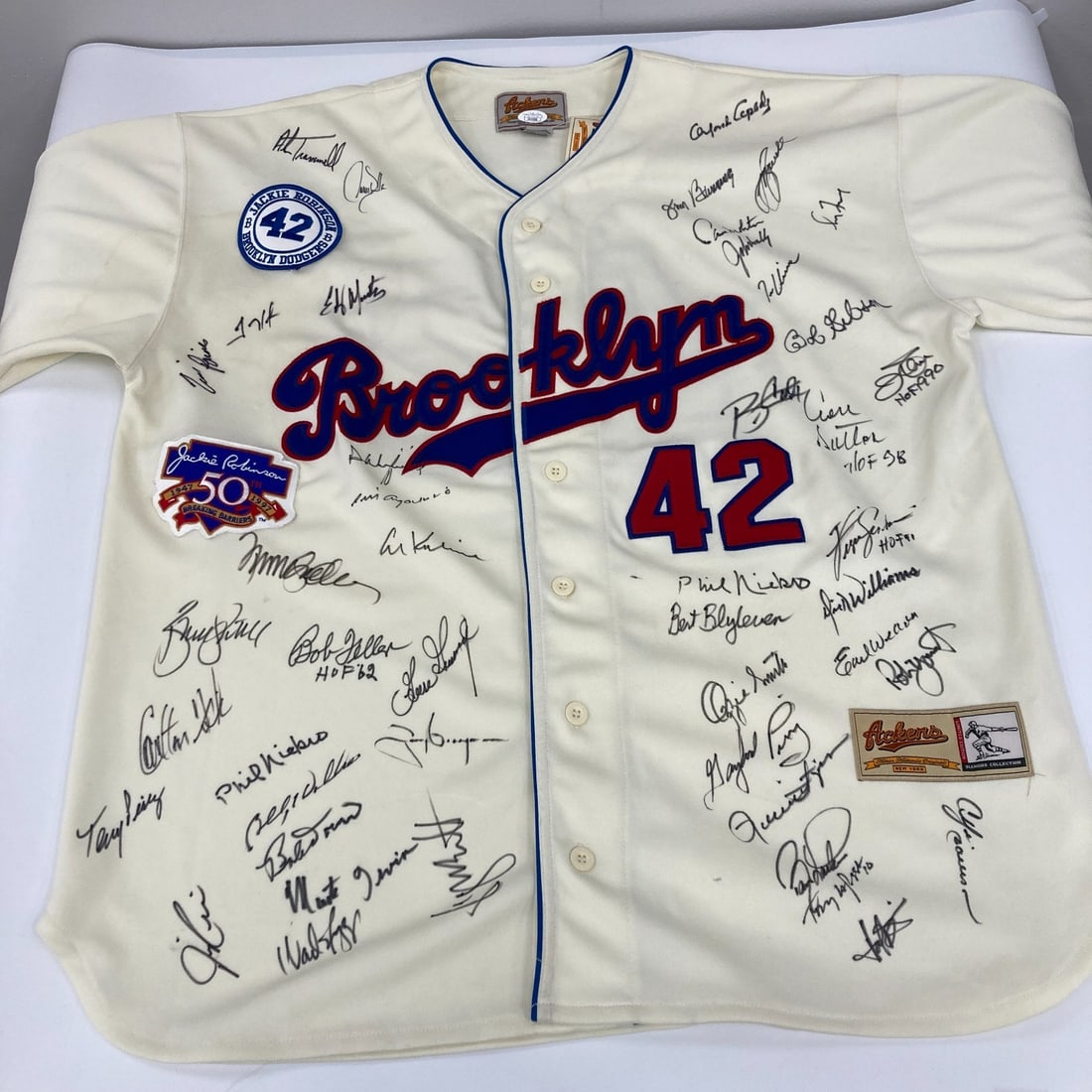 Jackie Robinson Multi Signed Jersey 45+ Autographs JSA COA: Jackie Robinson Multi Signed Jersey 45+ Autographs JSA COA This stunning Hall of Fame Multi Signed Jackie Robinson Jersey showcases over 45 authentic signatures, making it a remarkable collectible for