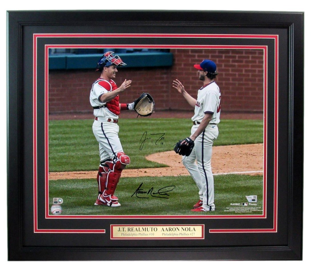 J.T. Realmuto Aaron Nola Dual-Signed Framed 16x20 Photo Phillies Fanatics Authenticated: J.T. Realmuto Aaron Nola Dual-Signed Framed 16x20 Photo Phillies Fanatics Authenticated This stunning 16x20 photo features J.T. Realmuto and Aaron Nola, both dual-signed, celebrating their contributio