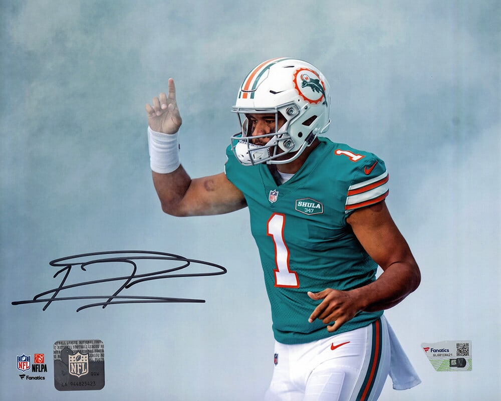 Tua Tagovailoa Signed Dolphins Teal Jersey with 8x10 Photo COA: Tua Tagovailoa Signed Dolphins Teal Jersey with 8x10 Photo COA This is a signed teal jersey of Tua Tagovailoa, the celebrated Miami Dolphins quarterback, featuring an 8x10 photo of him pointing. The j