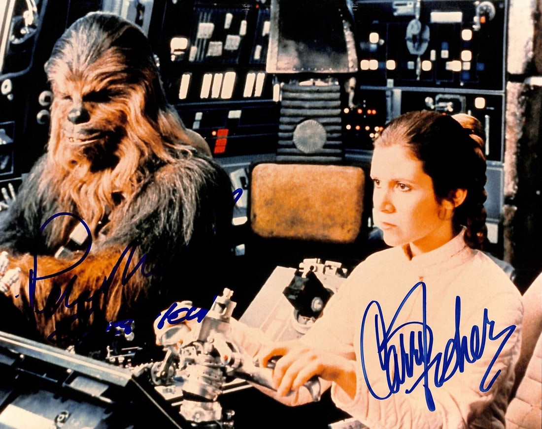 8x10 Star Wars Photo Signed by Carrie Fisher and Peter Mayhew Beckett LOA: 8x10 Star Wars Photo Signed by Carrie Fisher and Peter Mayhew Beckett LOA This is an original 8x10 inch color photograph from Star Wars: The Empire Strikes Back, autographed by Carrie Fisher and Peter