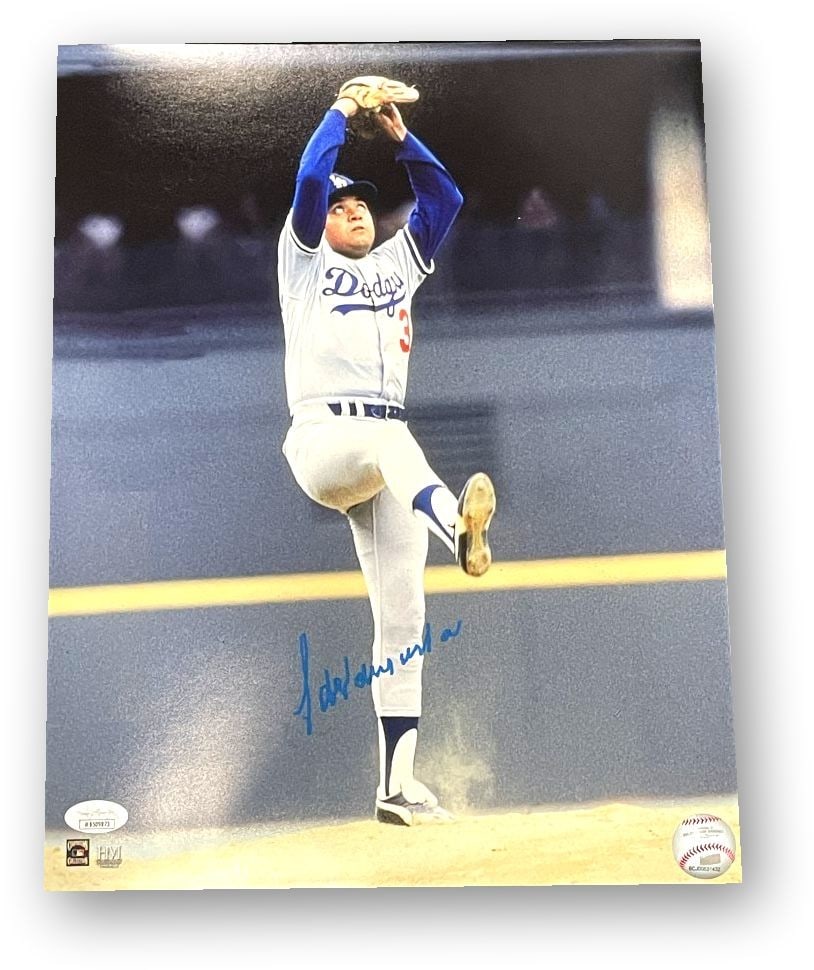 Fernando Valenzuela Autographed 11x14 Photo Dodgers MLB Authenticated: Fernando Valenzuela Autographed 11x14 Photo Dodgers MLB Authenticated This original 11x14 photo features Fernando Valenzuela in his iconic wind-up pose, beautifully autographed to commemorate his rema