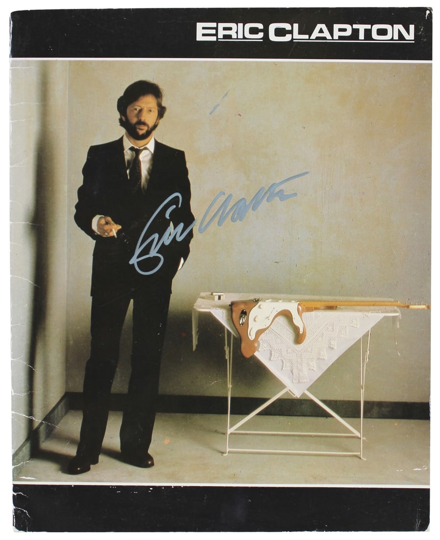 Eric Clapton Signed 9x11.5 Money & Cigarettes Program JSA Certified: Eric Clapton Signed 9x11.5 Money & Cigarettes Program JSA Certified This authentic 1983 Money & Cigarettes program, measuring 9x11.5 inches, has been personally signed by the legendary Eric Clapton. I
