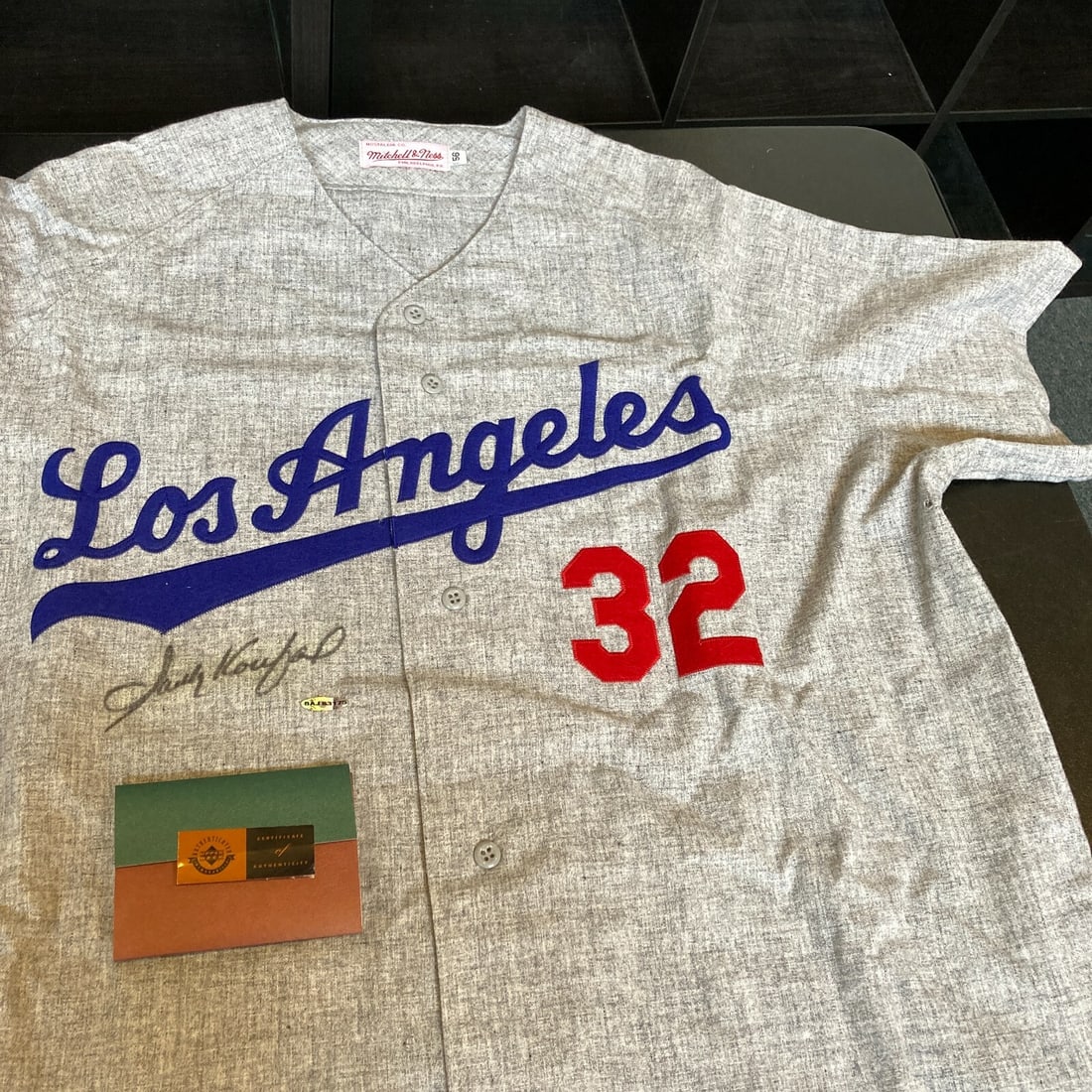 Los Angeles Dodgers Jersey Signed by Sandy Koufax with Upper Deck COA: Los Angeles Dodgers Jersey Signed by Sandy Koufax with Upper Deck COA This is a Los Angeles Dodgers jersey signed by Sandy Koufax. The autograph is authenticated by Upper Deck and comes with a UDA COA