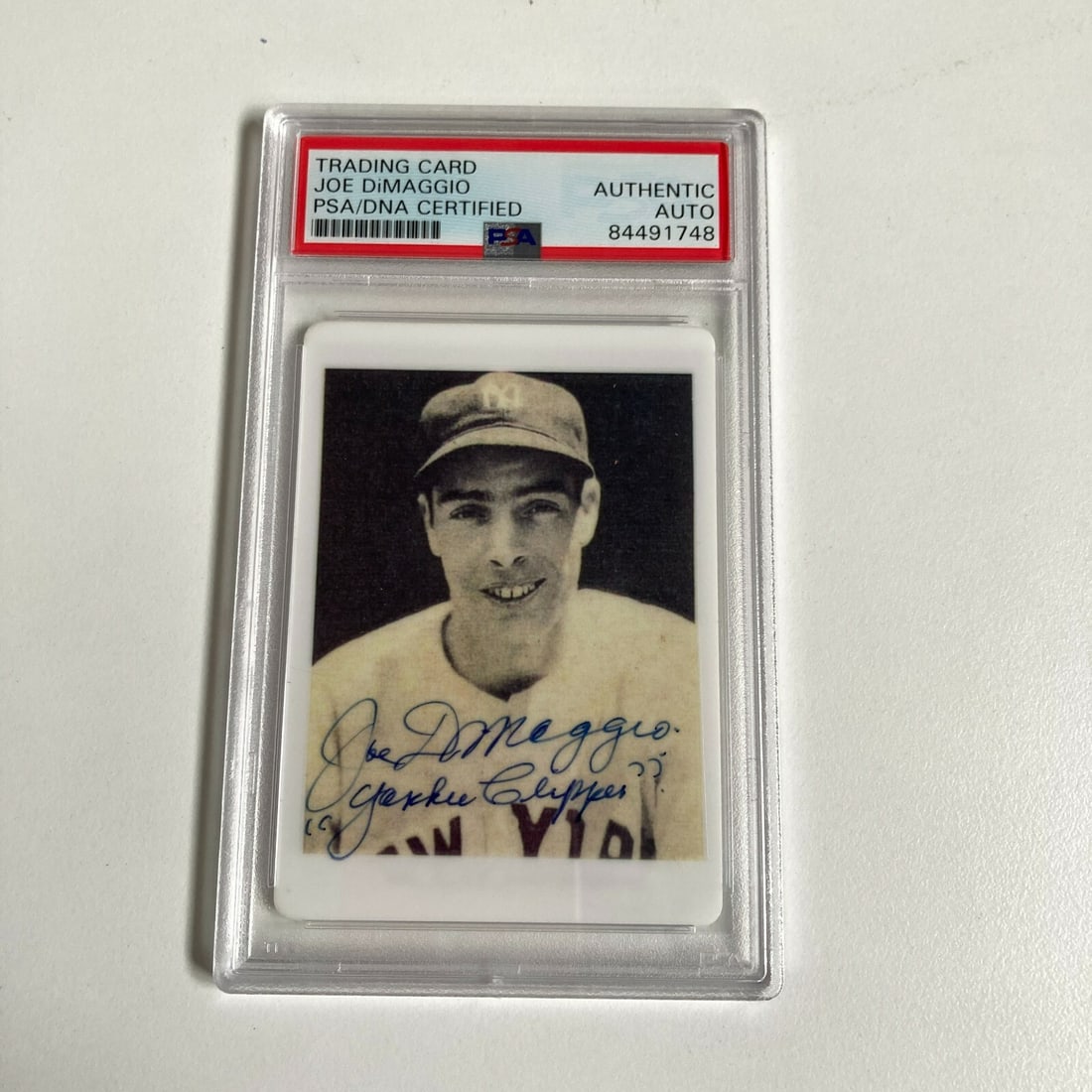 1939 Play Ball Joe Dimaggio Signed Porcelain Card PSA Authenticated: 1939 Play Ball Joe Dimaggio Signed Porcelain Card PSA Authenticated This exquisite 1939 Play Ball Joe DiMaggio "Yankee Clipper" signed porcelain baseball card is a remarkable collectible for any baseb