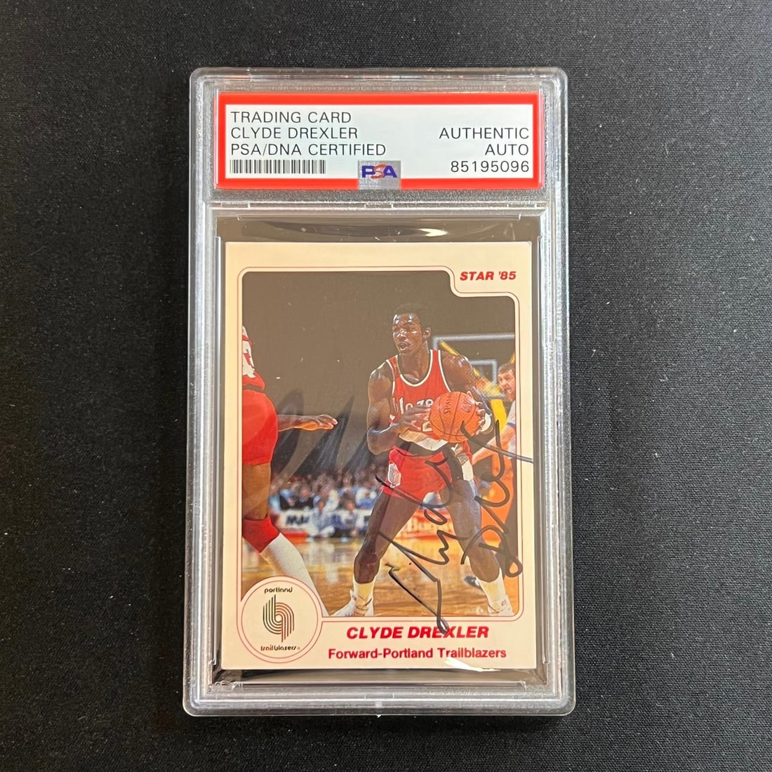 1984-85 NBA Star Clyde Drexler Signed Card PSA Authenticated #165: 1984-85 NBA Star Clyde Drexler Signed Card PSA Authenticated #165 This 1984-85 NBA Star '85 trading card features Clyde Drexler, a prominent player who notably coached the Portland Trail Blazers. This