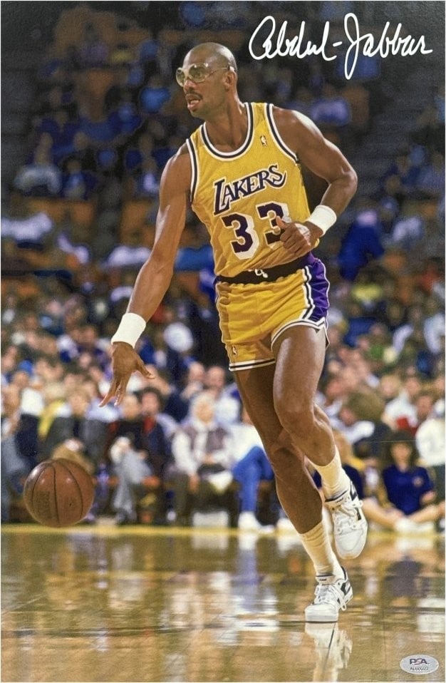 12x18 Matted Photo Signed by Kareem Abdul-Jabbar PSA Authenticated: 12x18 Matted Photo Signed by Kareem Abdul-Jabbar PSA Authenticated This is an original 12x18 matted photo autographed by Kareem Abdul-Jabbar, featuring his time with the Los Angeles Lakers. The autogr