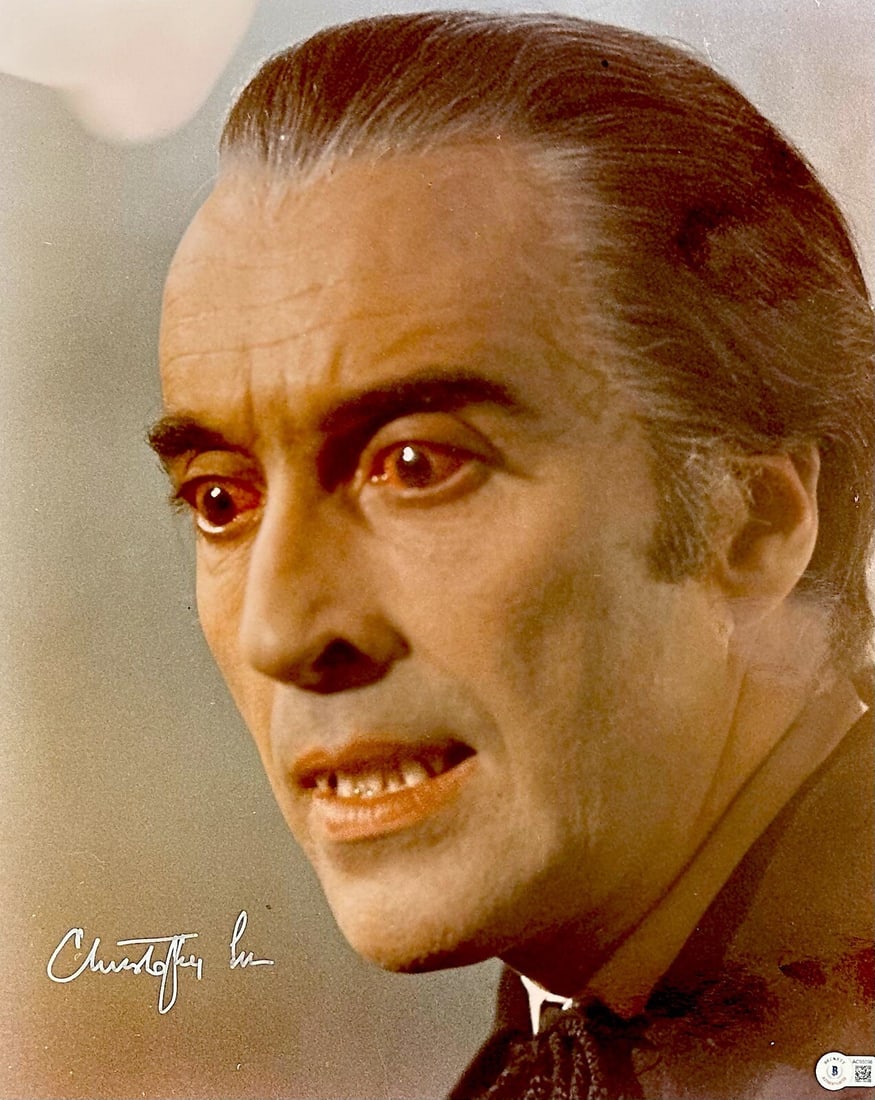 Christopher Lee Signed Dracula 16x20 Photo with Beckett LOA: Christopher Lee Signed Dracula 16x20 Photo with Beckett LOA This striking 16x20 photograph features the legendary Christopher Lee in his iconic role as Dracula, beautifully autographed in silver paint
