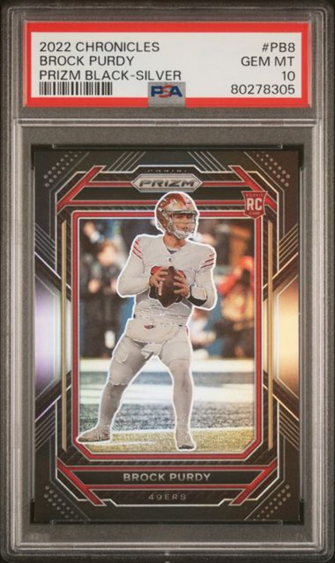 PSA 10 Brock Purdy 2022 Prizm Black Silver Rookie Card #PB8: PSA 10 Brock Purdy 2022 Prizm Black Silver Rookie Card #PB8 This is a 2022 Chronicles Prizm Black Silver rookie card featuring Brock Purdy of the San Francisco 49ers. The card is graded 10 by Professi