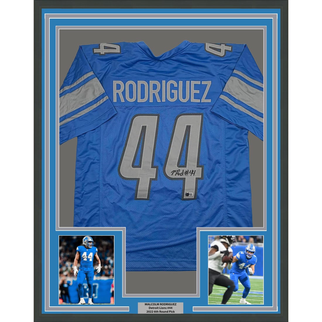 Malcolm Rodriguez Signed Detroit Lions Jersey Framed 35x39 With Beckett COA: Malcolm Rodriguez Signed Detroit Lions Jersey Framed 35x39 With Beckett COA This is a professionally framed and matted Detroit Lions blue jersey autographed by Malcolm Rodriguez. The display includes