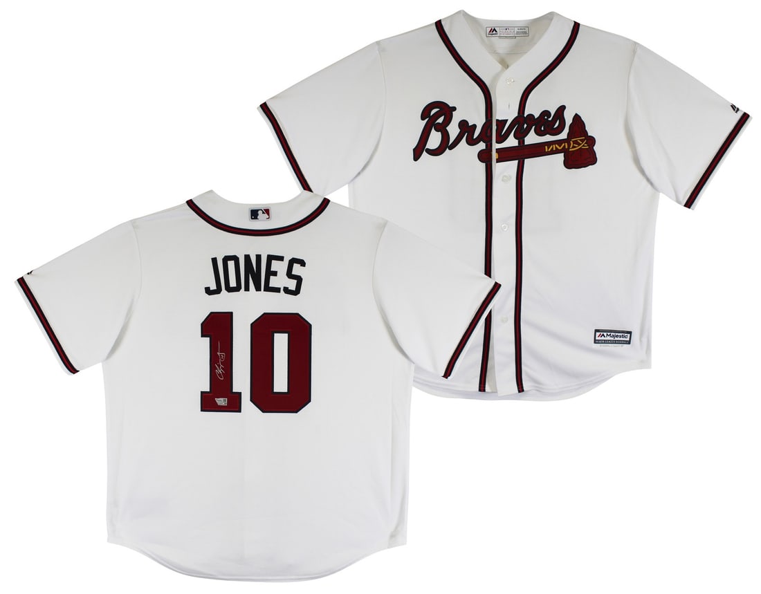 Chipper Jones Signed Atlanta Braves White Majestic Jersey with Fanatics Hologram: Chipper Jones Signed Atlanta Braves White Majestic Jersey with Fanatics Hologram Celebrate the legacy of Chipper Jones with this authentic signed white Majestic Cool Base jersey. Featuring a striking