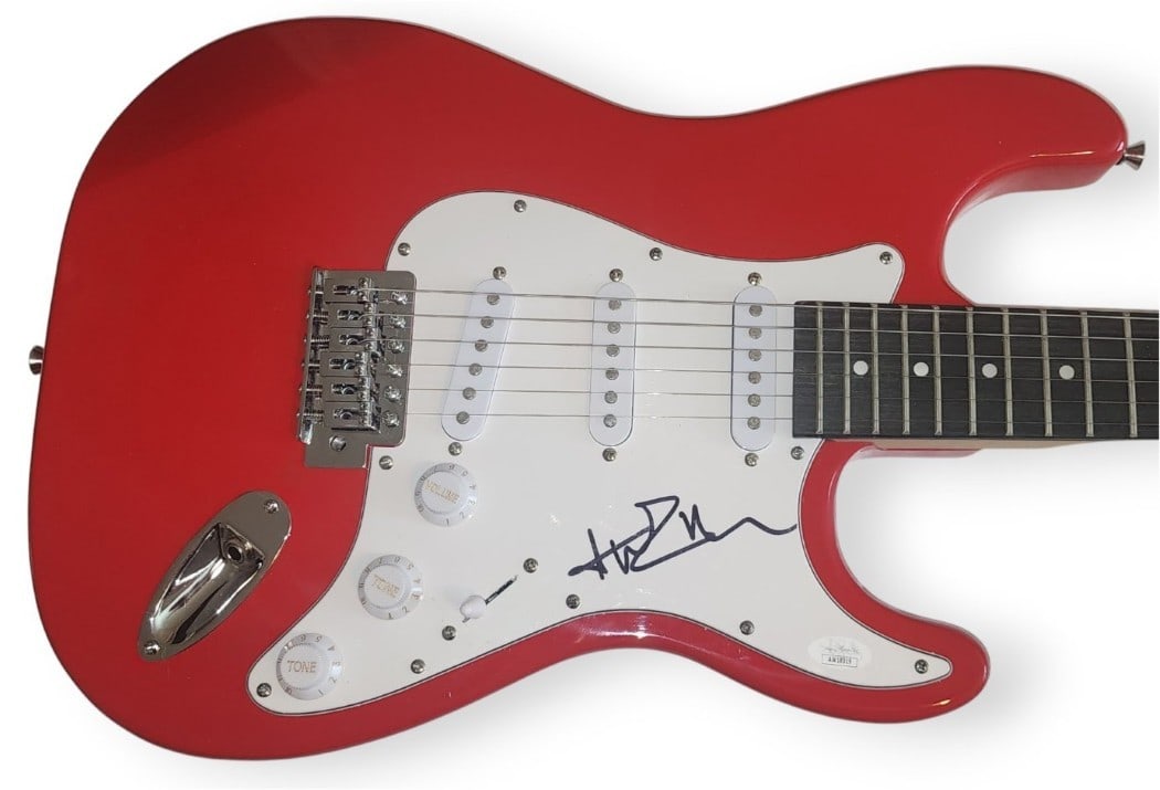 Avril Lavigne Autographed Electric Guitar with JSA Authentication: Avril Lavigne Autographed Electric Guitar with JSA Authentication This is an authentic Avril Lavigne signed electric guitar, perfect for fans and collectors. The guitar comes with a James Spence Authe