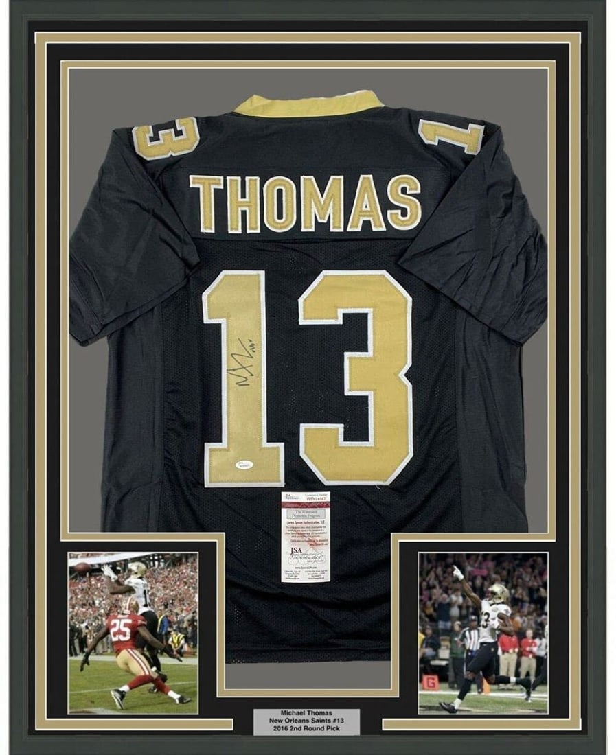 Framed Autographed Michael Thomas Black Jersey 33x42 JSA COA NFL: Framed Autographed Michael Thomas Black Jersey 33x42 JSA COA NFL Celebrate your love for football with this professionally framed autographed jersey of NFL star Michael Thomas. The jersey, representin