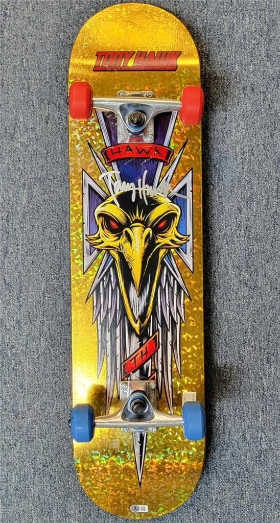 Tony Hawk Signed Gold Skateboard Deck Beckett BAS Authenticated: Tony Hawk Signed Gold Skateboard Deck Beckett BAS Authenticated This is an original skateboard deck featuring the iconic Tony Hawk's signature from the Signature Series. The autograph has been authent