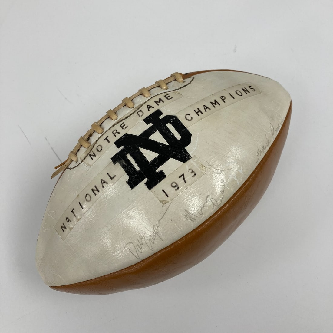 1973 Notre Dame Fighting Irish Signed National Champions Football: 1973 Notre Dame Fighting Irish Signed National Champions Football Celebrate the legacy of college football with this 1973 Notre Dame Fighting Irish National Champions Team Signed Football. This origin