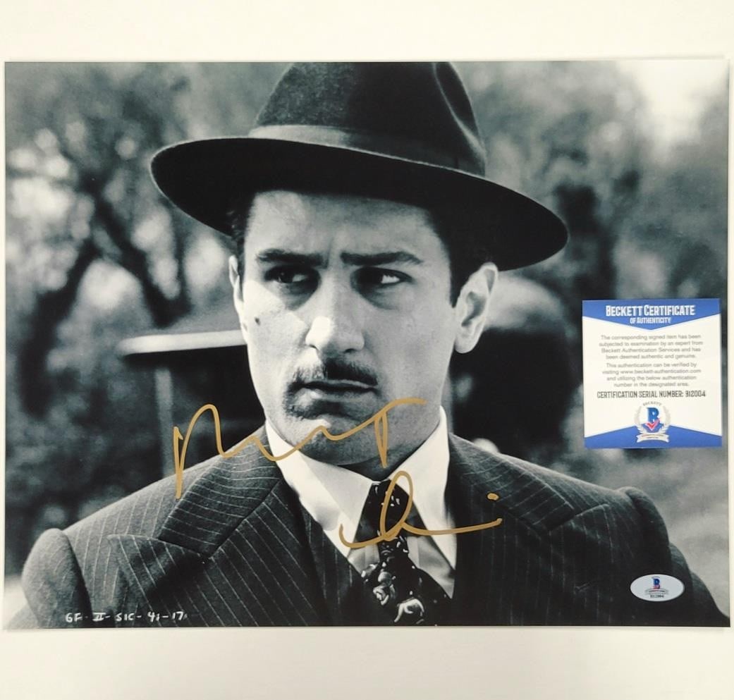 Robert De Niro Signed The Godfather 11x14 Photo Beckett Authenticated: Robert De Niro Signed The Godfather 11x14 Photo Beckett Authenticated This is an original 11x14 photograph featuring Robert De Niro's iconic portrayal in the classic film, The Godfather. The photo has