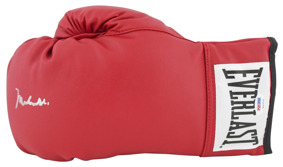 Muhammad Ali Signed Red Everlast Boxing Glove PSA/DNA Certified: Muhammad Ali Signed Red Everlast Boxing Glove PSA/DNA Certified This authentic red Everlast boxing glove has been personally signed by the legendary Muhammad Ali, ensuring its status as a treasured co