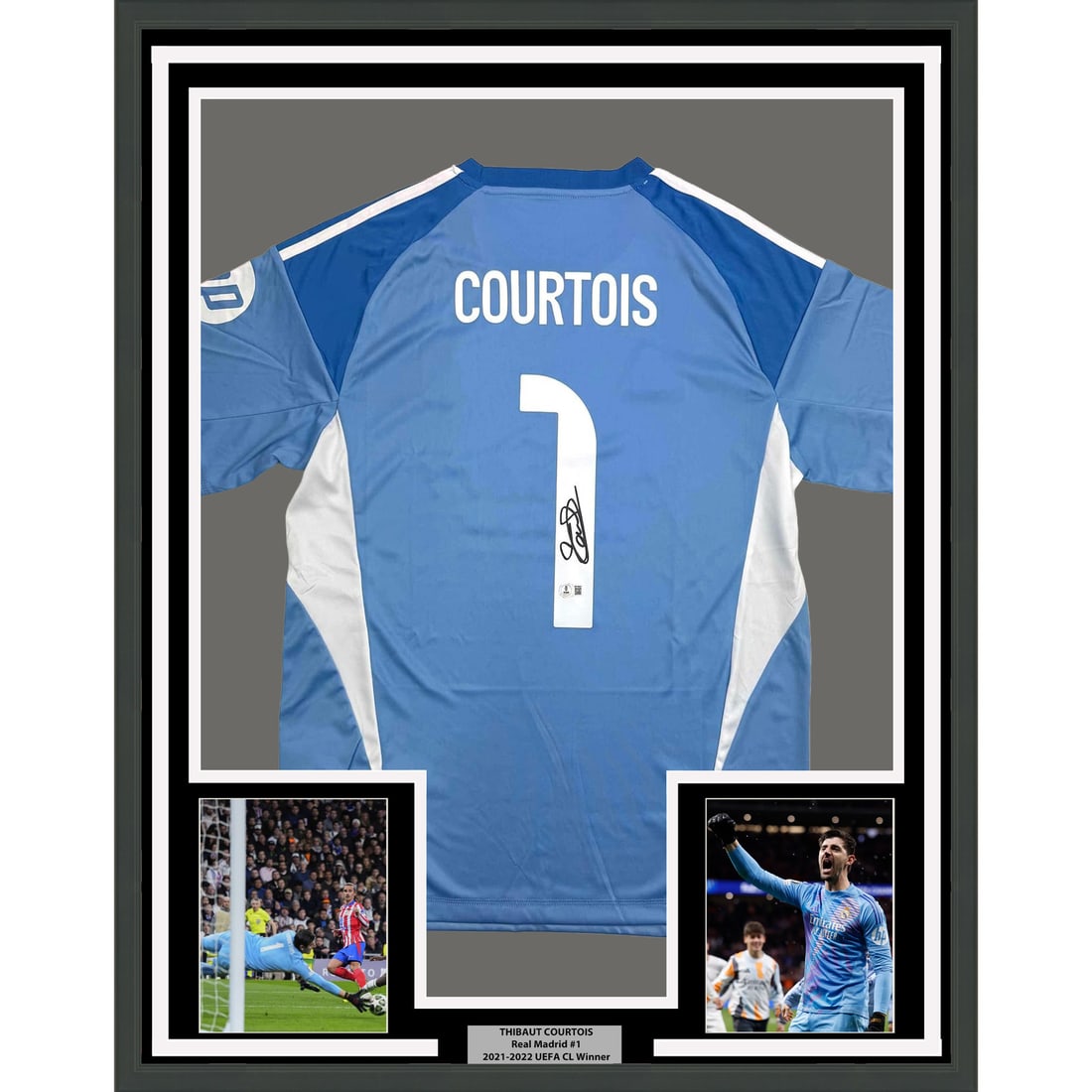 Thibaut Courtois Signed Real Madrid Jersey 35x39 Framed With Beckett COA: Thibaut Courtois Signed Real Madrid Jersey 35x39 Framed With Beckett COA This is a professionally framed and matted Real Madrid jersey autographed by Thibaut Courtois. The display includes two 5x7 pho