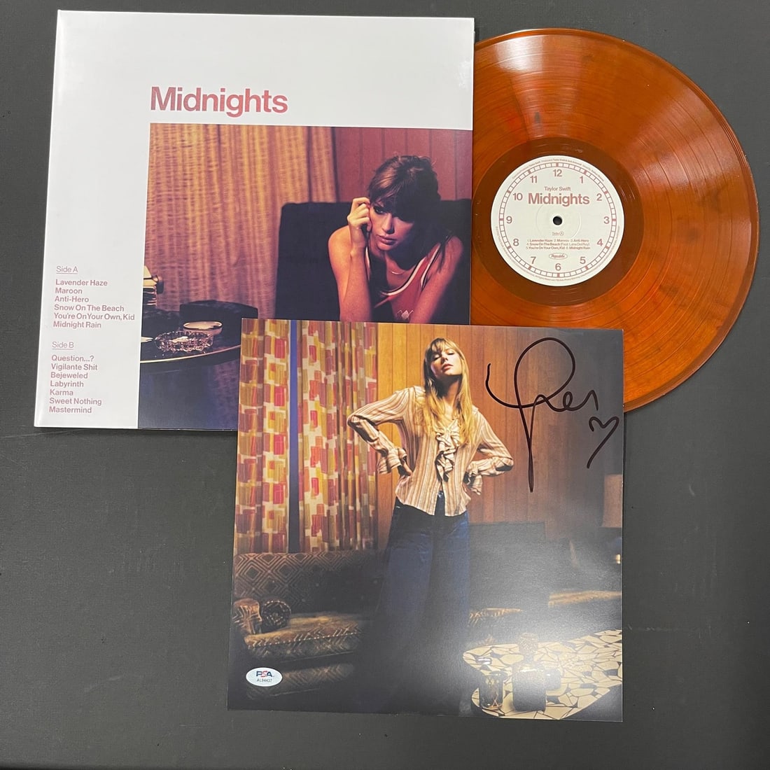 Taylor Swift Blood Moon Vinyl Insert Autographed PSA/DNA Midnights: Taylor Swift Blood Moon Vinyl Insert Autographed PSA/DNA Midnights This item features a Blood Moon vinyl insert from Taylor Swift's album 'Midnights', beautifully autographed by the artist herself. Th