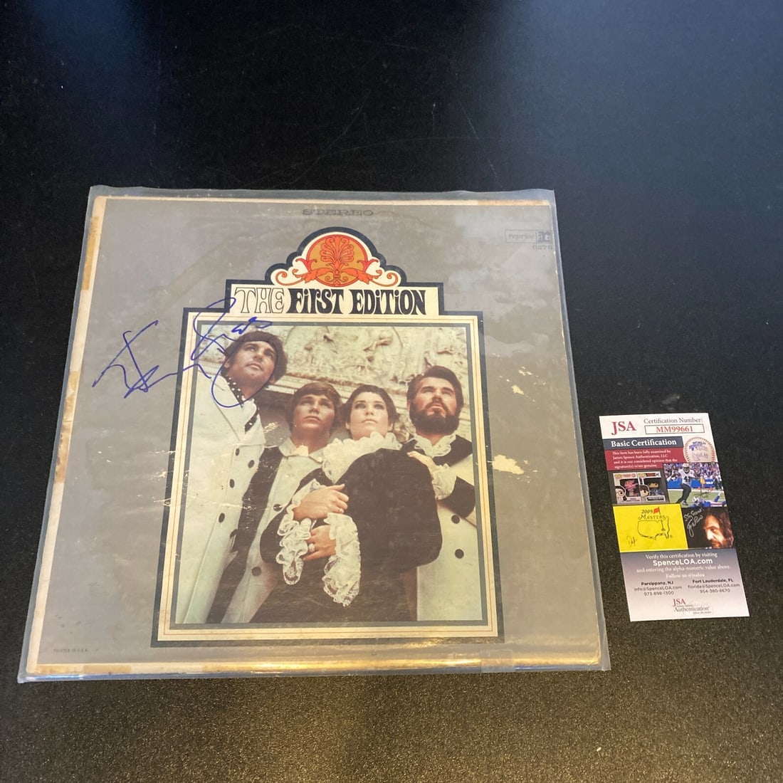 Kenny Rogers The First Edition Signed LP Album With JSA Authentication: Kenny Rogers The First Edition Signed LP Album With JSA Authentication This is an original LP record album by The First Edition, signed by Kenny Rogers. The autograph has been authenticated by James S