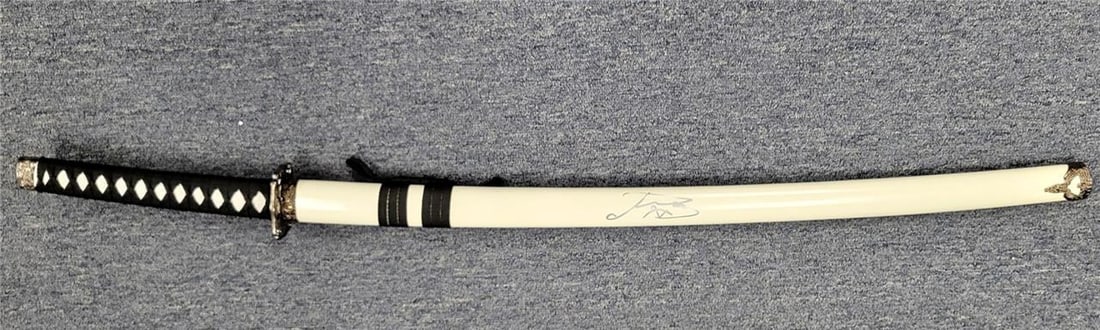 Anna Sawai Signed 38 Katana Sword Prop from Shogun Beckett Authenticated: Anna Sawai Signed 38 Katana Sword Prop from Shogun Beckett Authenticated This authentic movie prop features a 38" Katana sword from the show Shogun, signed by actress Anna Sawai. The item is certified