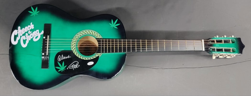 Cheech & Chong Autographed Acoustic Guitar JSA Certified: Cheech & Chong Autographed Acoustic Guitar JSA Certified This is an original acoustic guitar autographed by the legendary duo Cheech Marin and Tommy Chong. The autograph has been authenticated by Jame