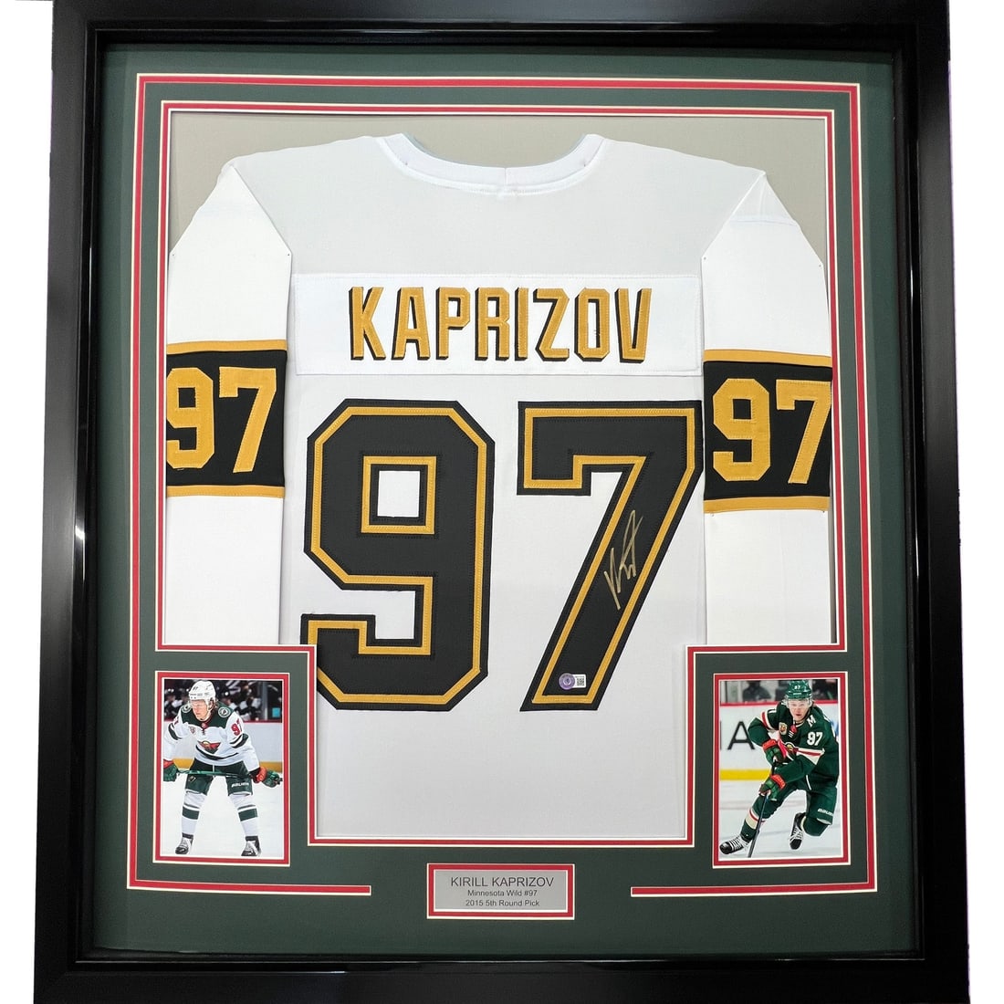 Framed Kirill Kaprizov Signed Jersey with BAS COA 35x39: Framed Kirill Kaprizov Signed Jersey with BAS COA 35x39 This stunning framed and autographed Kirill Kaprizov jersey showcases a white and gold design, perfect for any Minnesota Wild fan. The jersey is