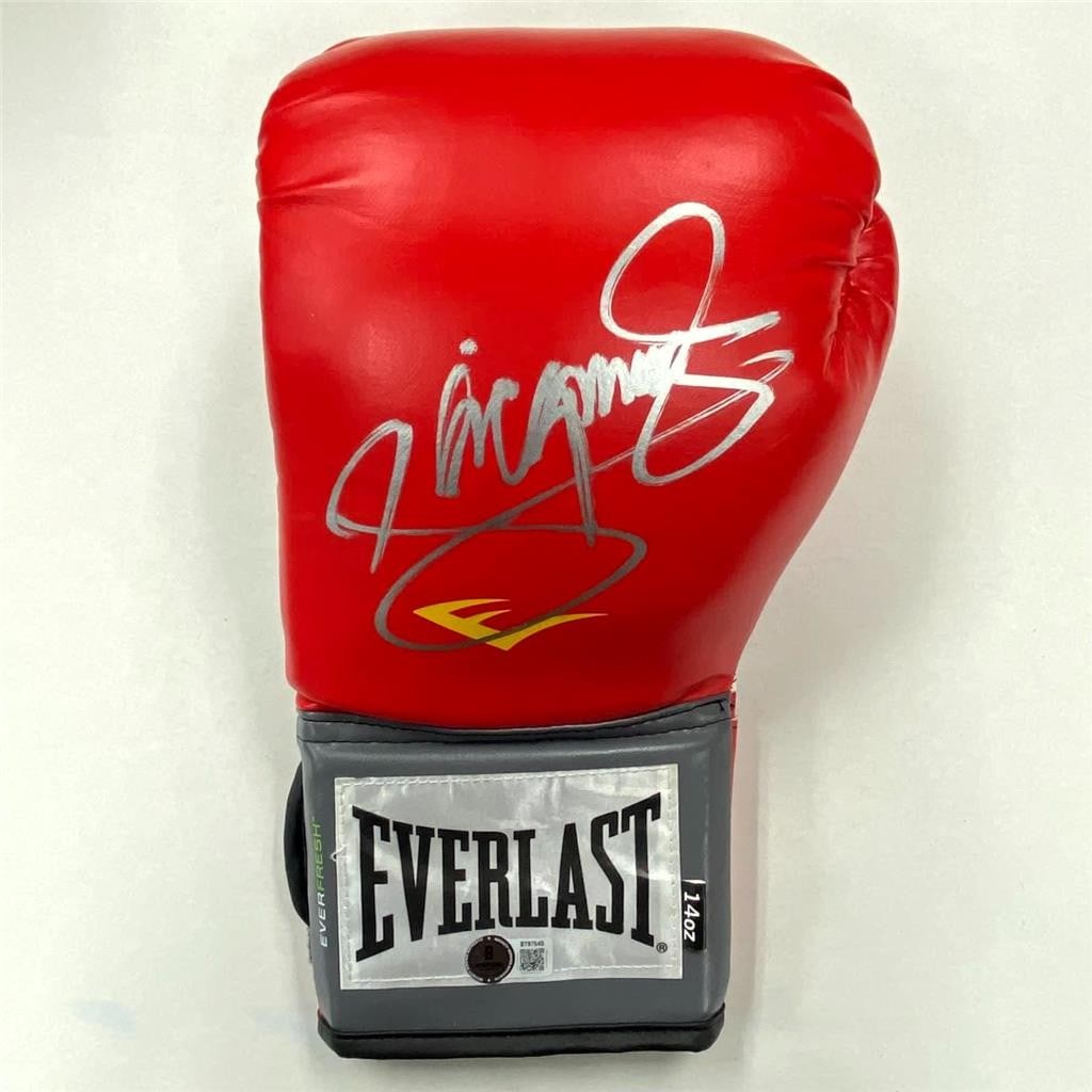 Everlast Boxing Glove with Manny Pacquiao Signature Beckett Authenticated: Everlast Boxing Glove with Manny Pacquiao Signature Beckett Authenticated This is a red Everlast boxing glove autographed by Manny Pacquiao. The glove's authenticity is verified by Beckett Authenticat