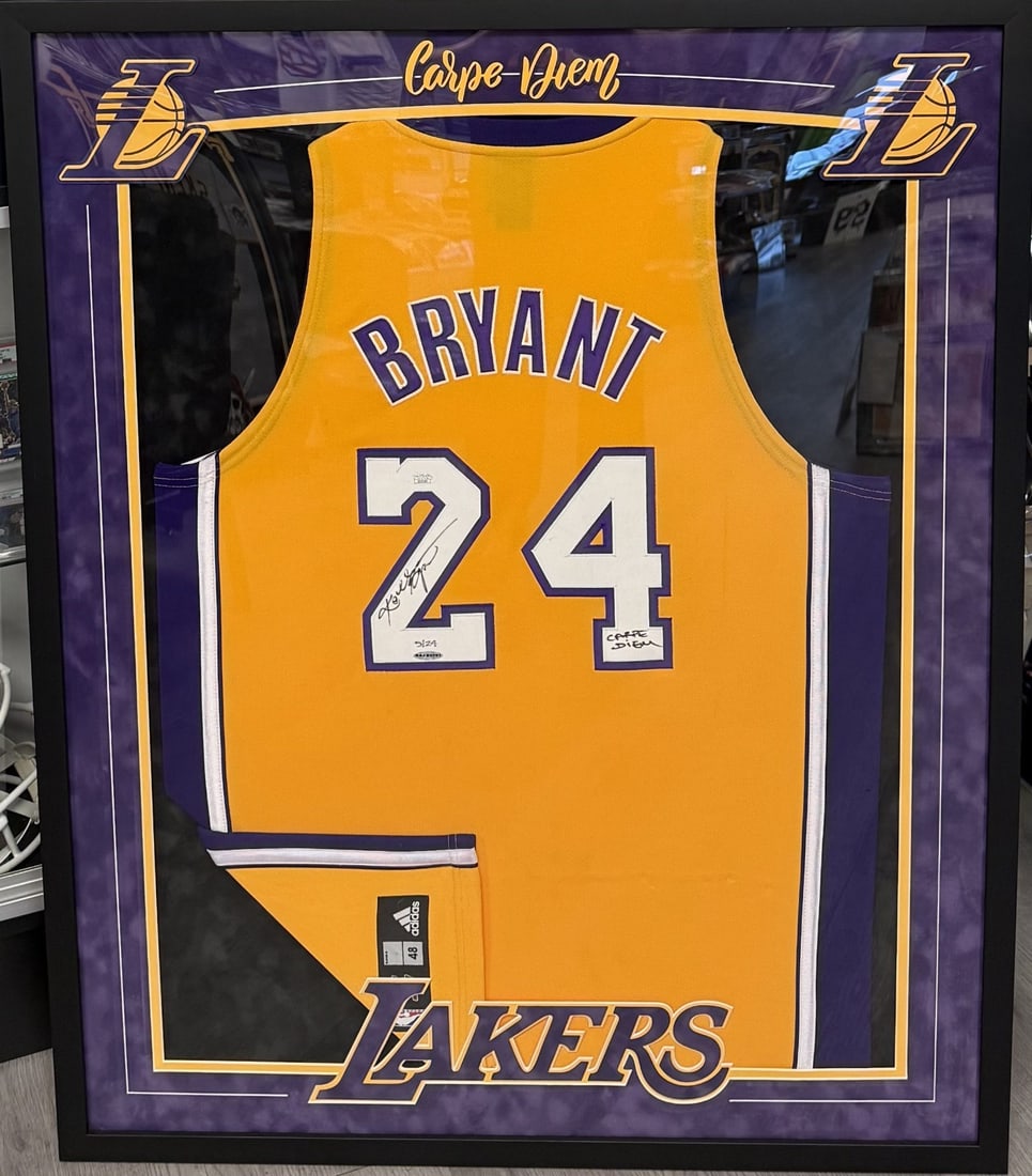 Kobe Bryant Autographed Lakers Jersey Carpe Diem Inscription JSA UDA 5 of 24: Kobe Bryant Autographed Lakers Jersey Carpe Diem Inscription JSA UDA 5 of 24 This is a white authentic game model Los Angeles Lakers #24 jersey, signed by Kobe Bryant. The jersey features Bryant's aut