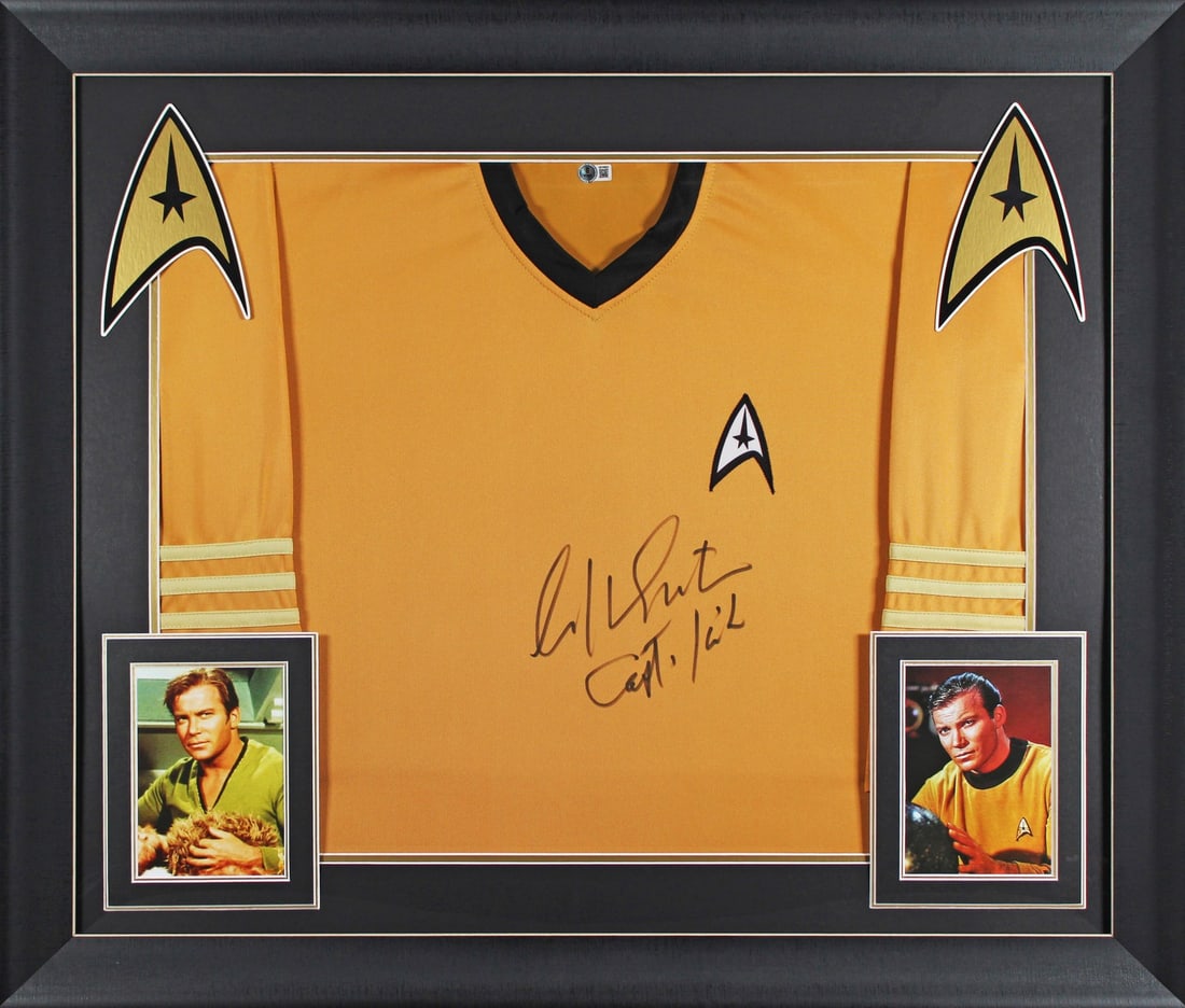 William Shatner Signed Star Trek Captain Kirk Framed Shirt BAS Witnessed: William Shatner Signed Star Trek Captain Kirk Framed Shirt BAS Witnessed This autographed and framed uniform shirt features the iconic "Captain Kirk" inscription and has been personally signed by Will