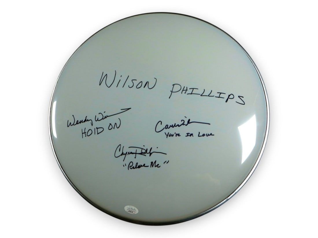 Wilson Phillips Autographed 16 Drumhead JSA Certified Chynna Carnie Wendy: Wilson Phillips Autographed 16 Drumhead JSA Certified Chynna Carnie Wendy This original 16" drumhead features the signatures of the iconic Wilson Phillips band members: Chynna Phillips, Carnie Wilson,